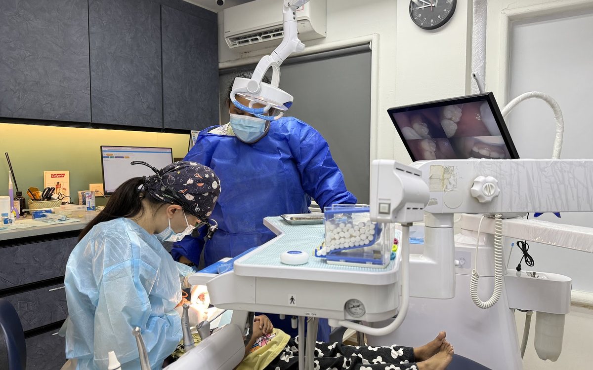 A SmileGram dentist treating a patient in Seksyen 14