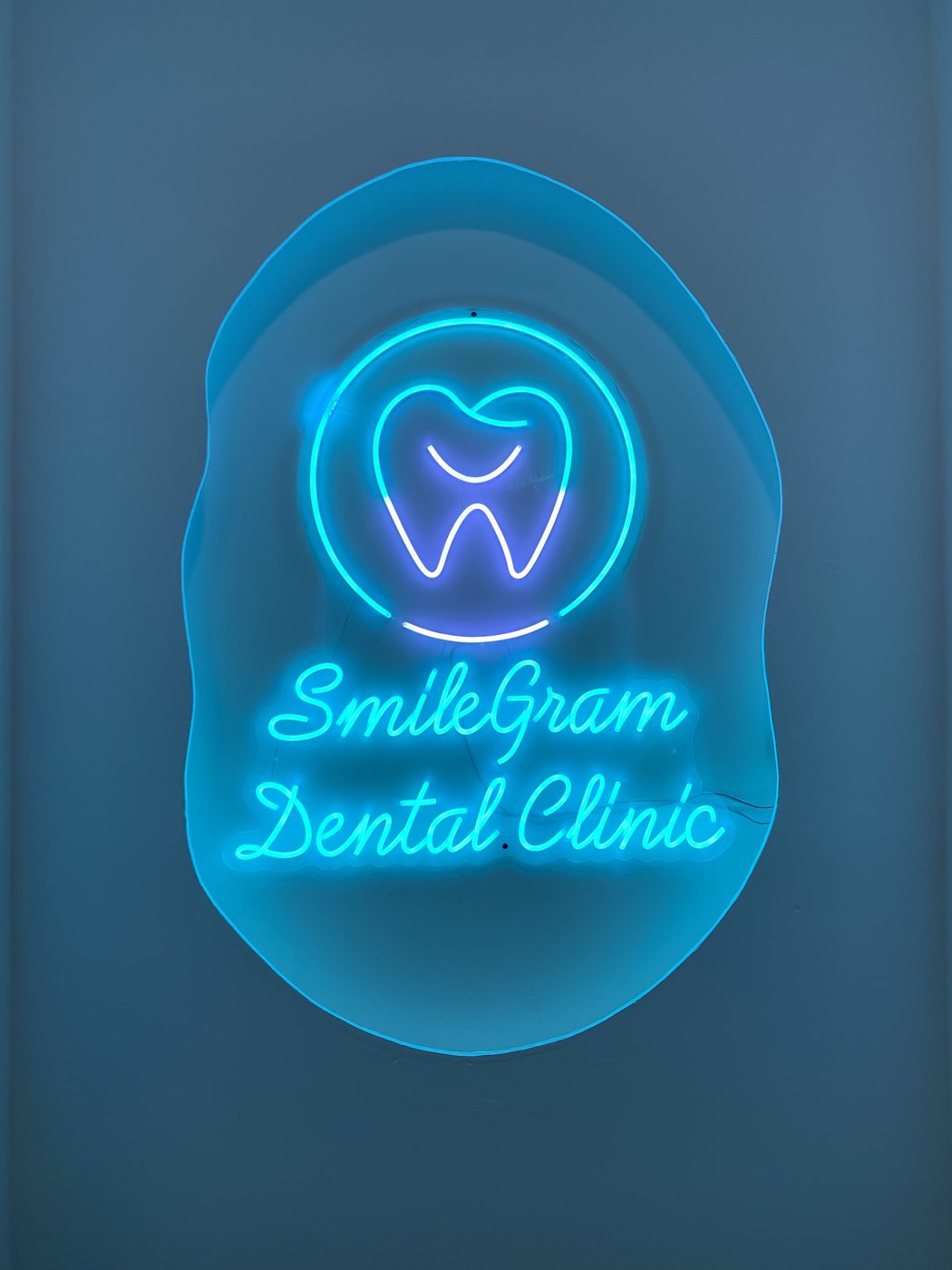 SmileGram Dental Clinic neon sign at the Seapark SS2 clinic
