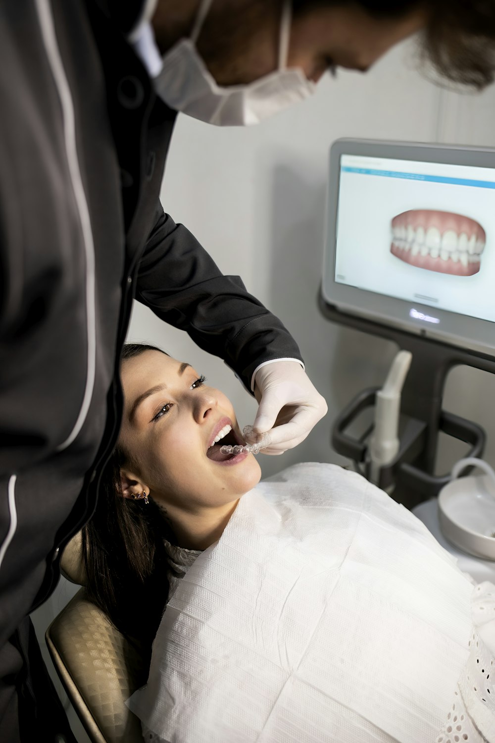 Dentist treating a patient at SmileGram Dental Clinic